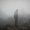 cool-man-standing-edge-foggy-mountain_181624-216